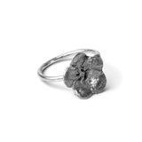 oxidised flower ring on white background