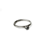 oxidised bud diamond ring on white background