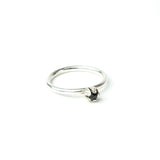 silver bud diamond ring on white background
