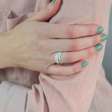 scattered seed rings on hand resting on arm