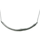 oxidised smooth twig necklace on white background