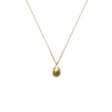 gold yew berry necklace on white background 
