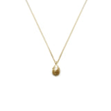 gold yew berry necklace on white background