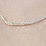 Silver Textured Twig Necklace on pink cloth