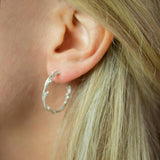 Silver Twisted Twig Hoops modelled in ear