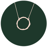 illustration of single eternity necklace on green circle background