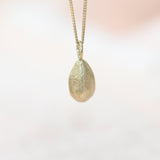 Gold Sunflower Seed Pendant