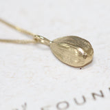Gold Sunflower Seed Pendant