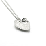 silver ivy leaf necklace on white background