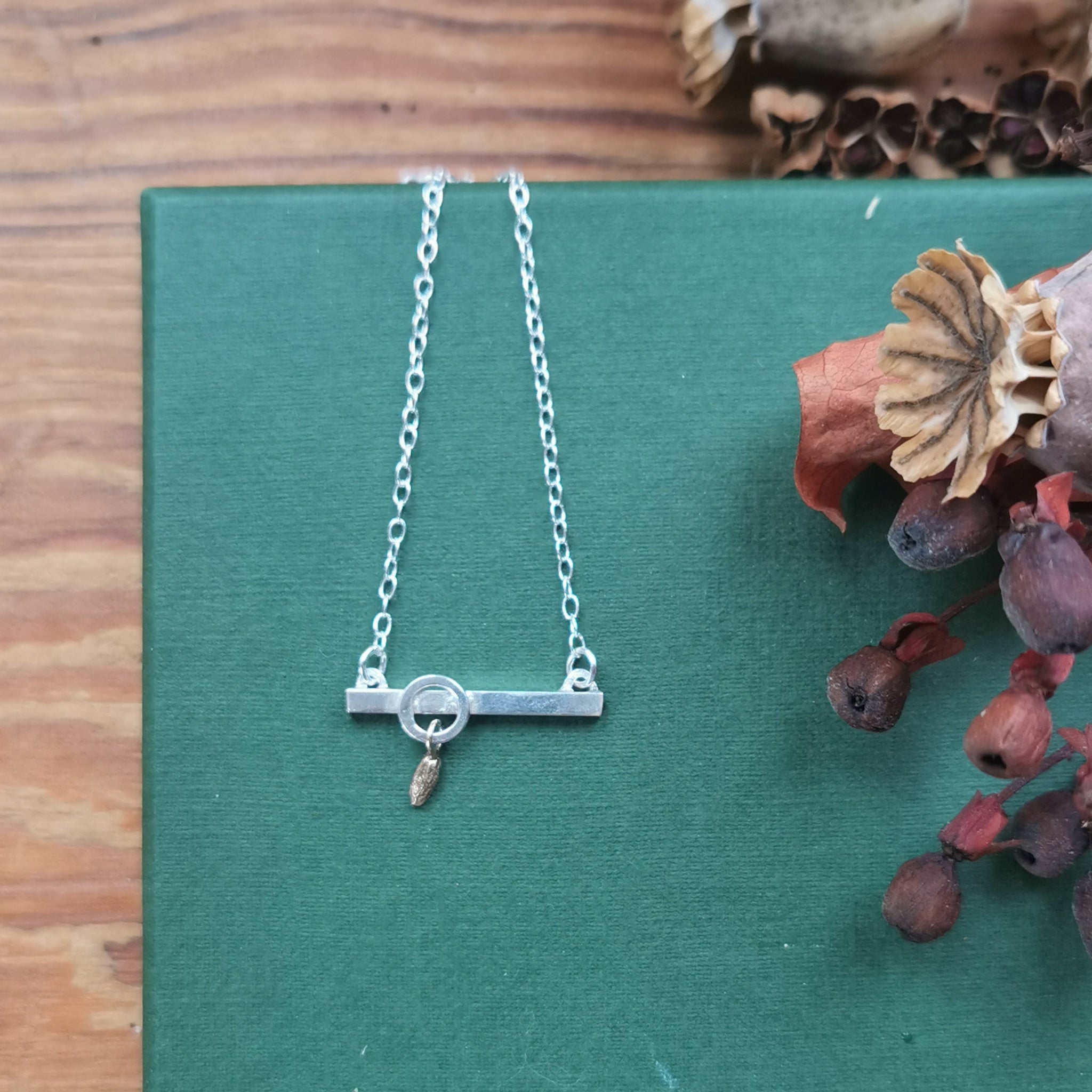 One off bar necklace with solid 9ct seed pod