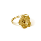 gold flower ring on white background