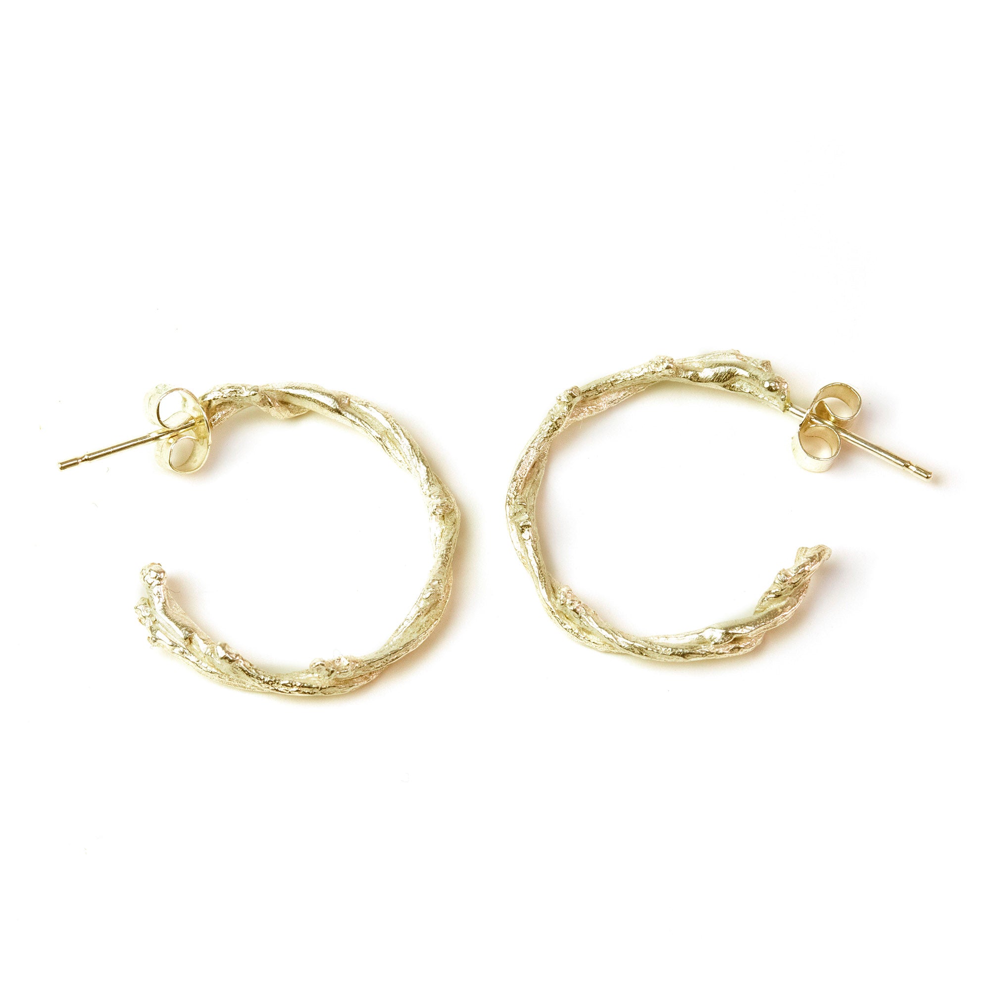 Gold Twisted Twig Hoops on white background