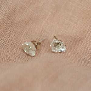 Small Blueweed Flower Stud Earrings on pink background