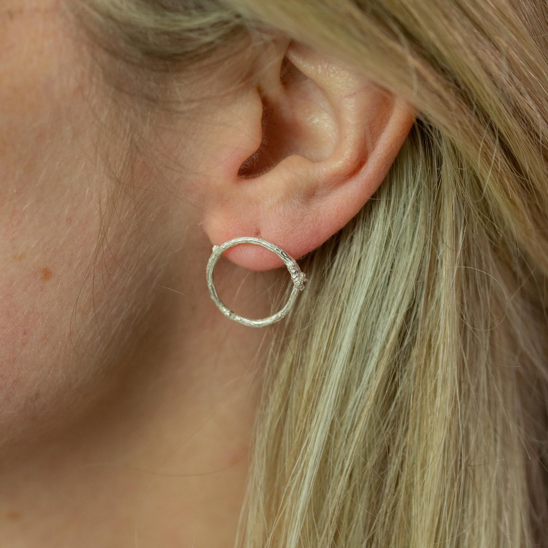 Silver Twig Circle Stud Earrings modelled on ear