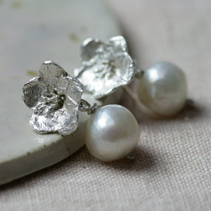 Flower and pearl drop earrings