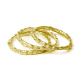 gold scattered seed rings on white background