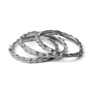 oxidised scattered seed rings on white background
