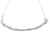 Silver Textured Twig Necklace on white background 