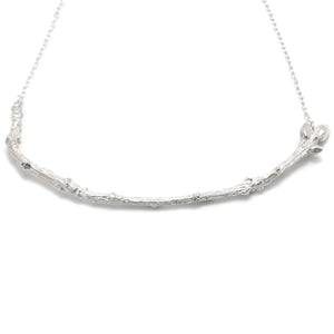 Silver Textured Twig Necklace on white background 